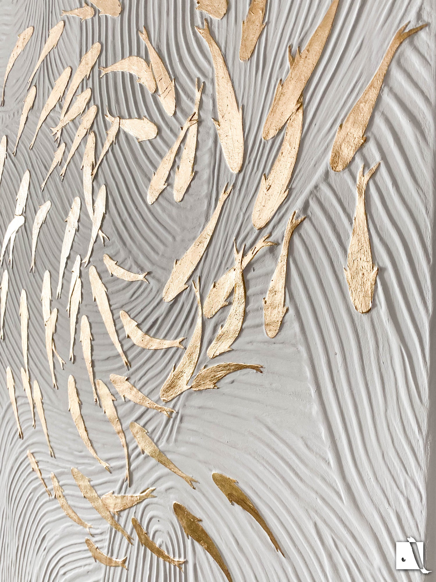 3D structured art piece with wavy lines imitating water and golden koy fish swimming in pound in relief. White acrylic background and golden leaf fish koy
