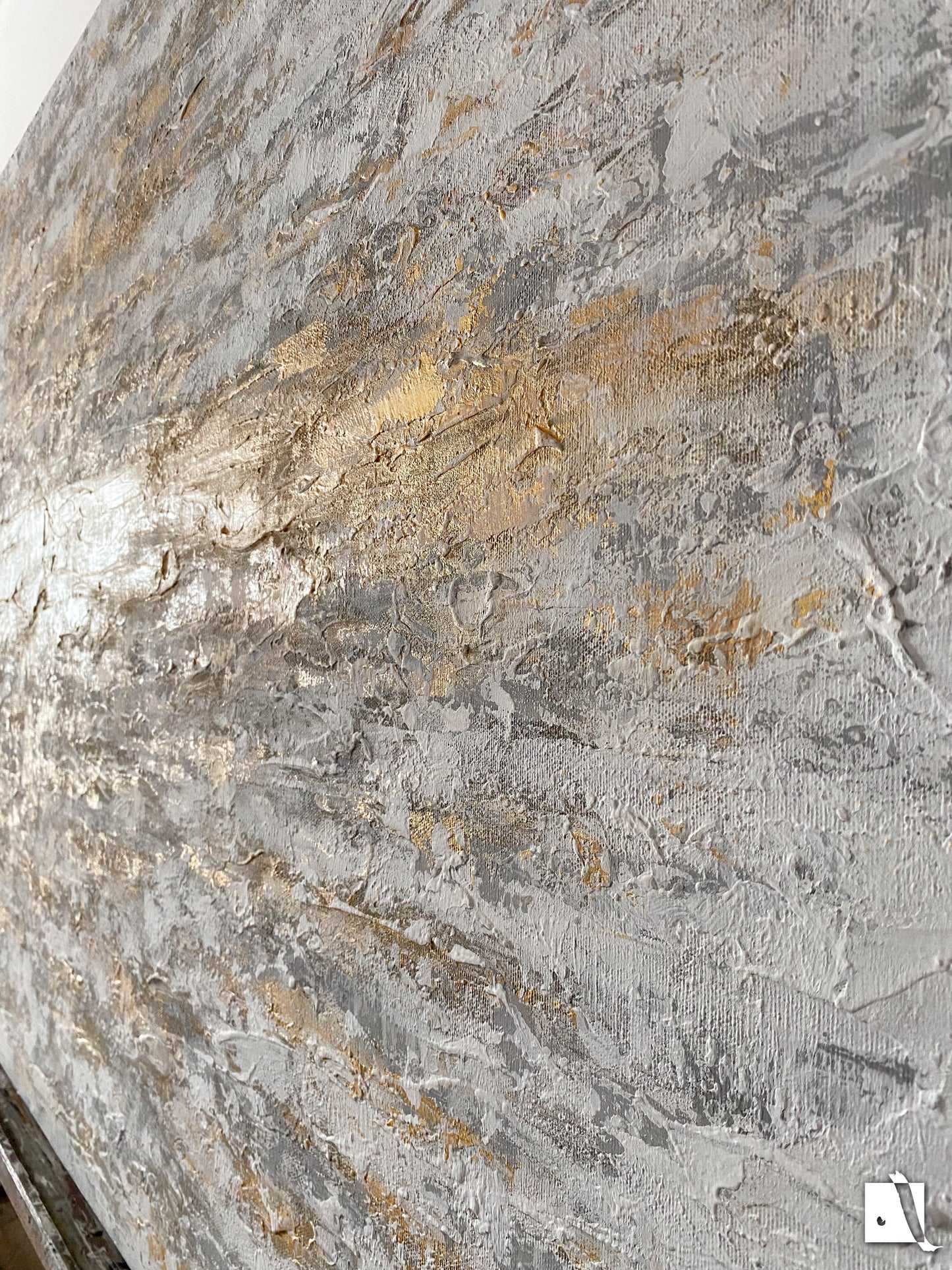 3D structured art piece in relief with gray, white and golden acruylic painting, golden vertical line in middle