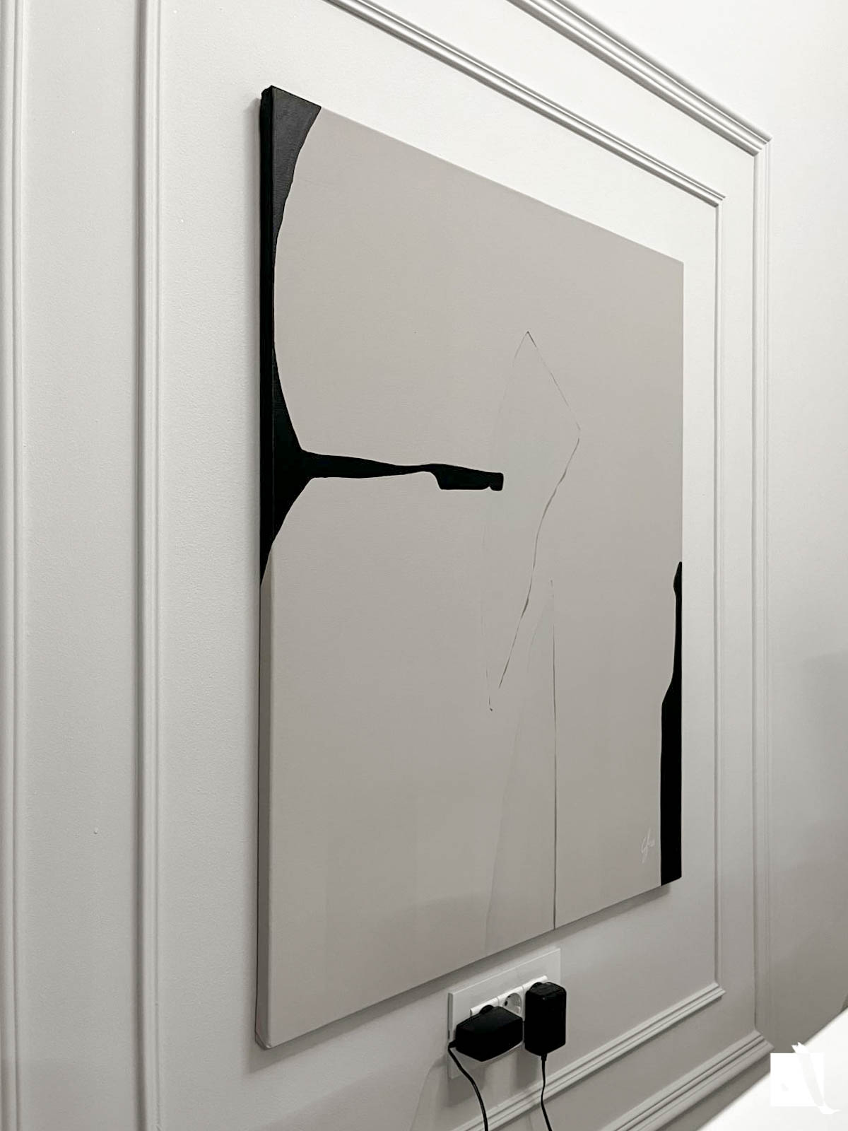 Abstract art piece on canvas with irregular formes, light cream and black