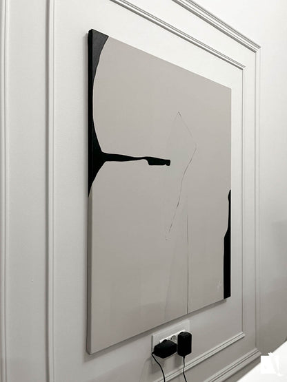 Abstract art piece on canvas with irregular formes, light cream and black